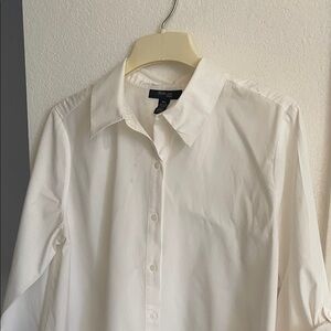 Perfect with leggings! The back button detail and the longer length